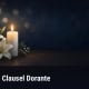 Fostoria News Memorial candle with white lilies for Clausel Dorante obituary.